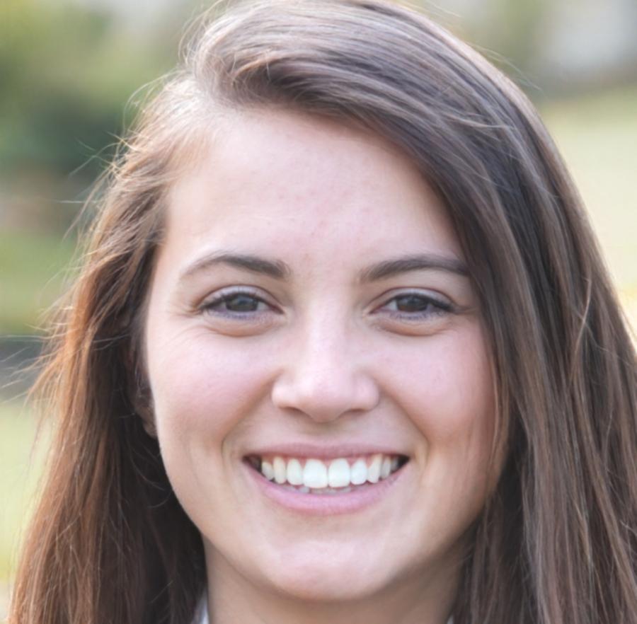 Instructor working at video editing station with dual monitor setup