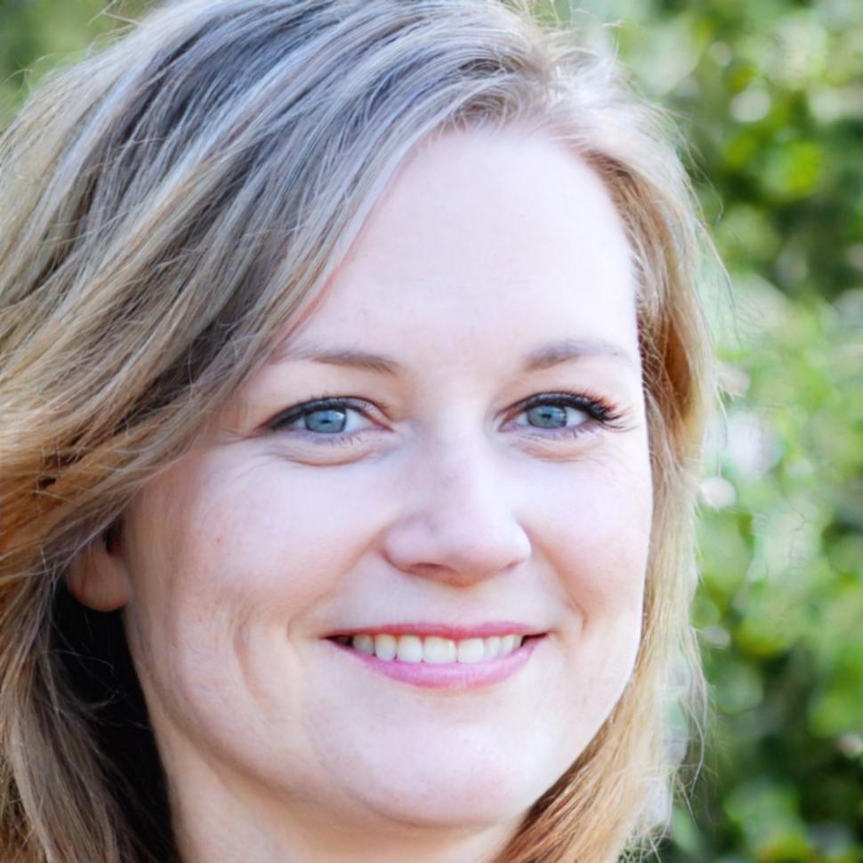 Instructor reviewing color grading work with student at workstation